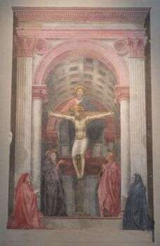 马萨丘的三位一体。已经褪色的耶稣在十字架上的画像。这张照片用了红色、白色和红色。